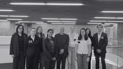 Black and white images scholars facing camera.